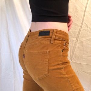 Levi’s mid rise skinny demi curve dark mustard corduroy